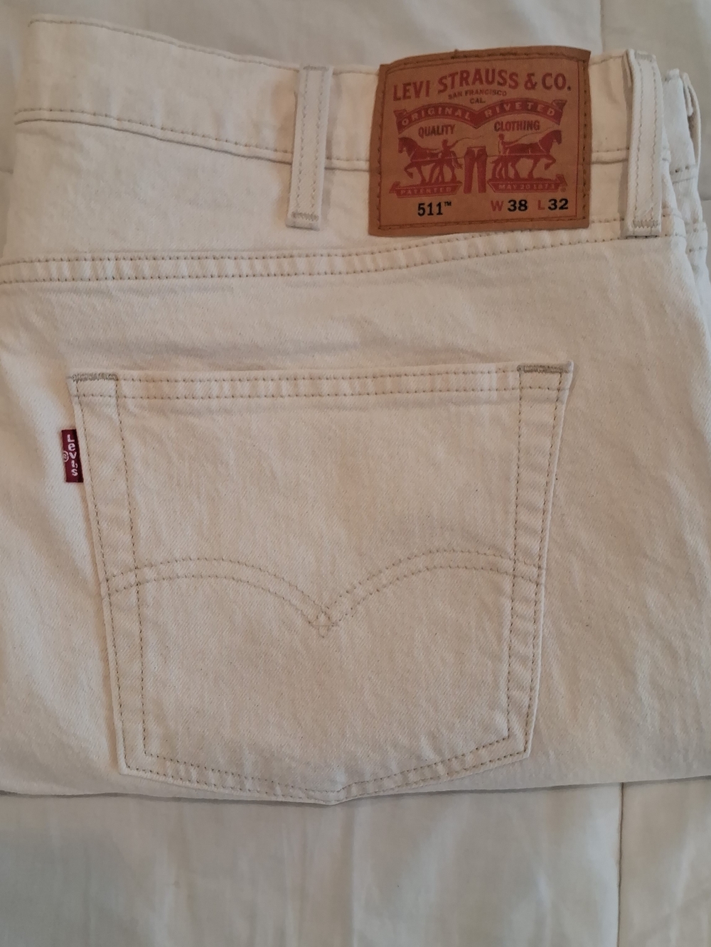 Levi's White Denim Jeans with Signature Back Pocket Built In Stretch Slim Fit